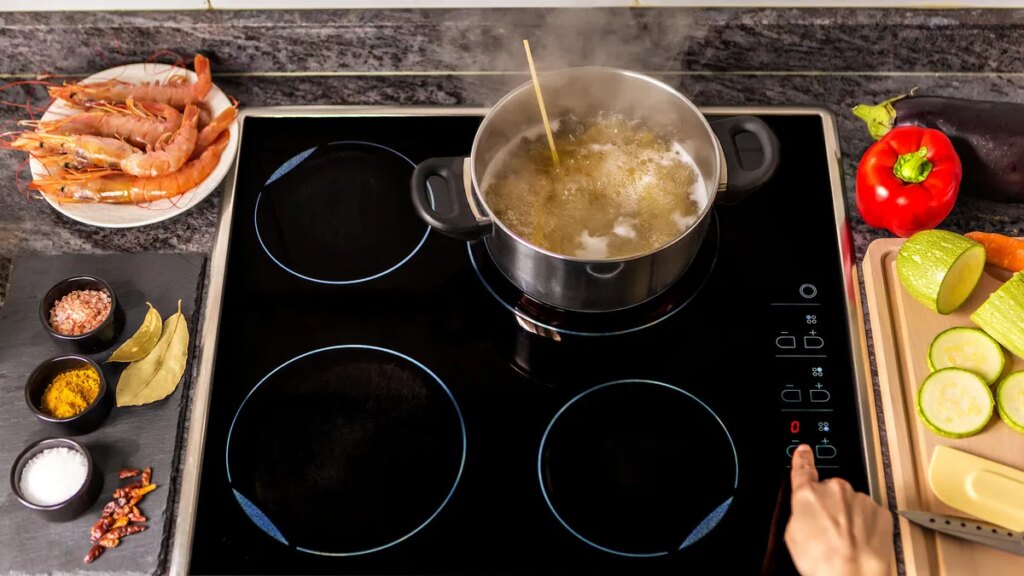 induction stove with pot of boiling water