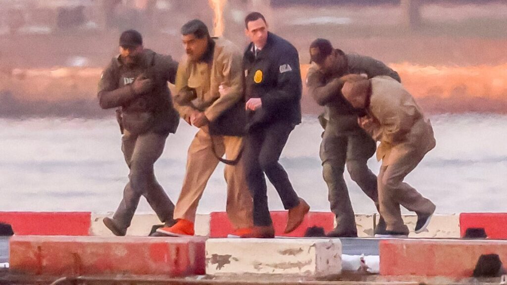 Ousted Venezuelan President Nicolas Maduro being escorted by US law enforcement officials.