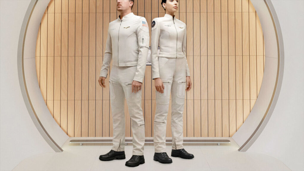 male and female models sport a two-piece white flight suit with hook-and-fastener attach points and pockets.
